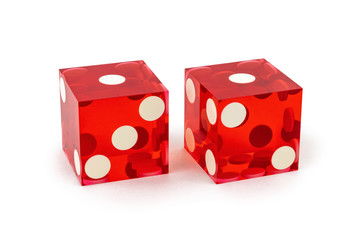 Two red professional game dice closeup isolated on a white background / one and one with a light shadow.