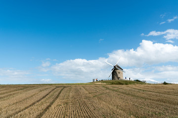 tourists visit the famous and historic Moidrey Windmill near Le Mont Saint-Michel in France