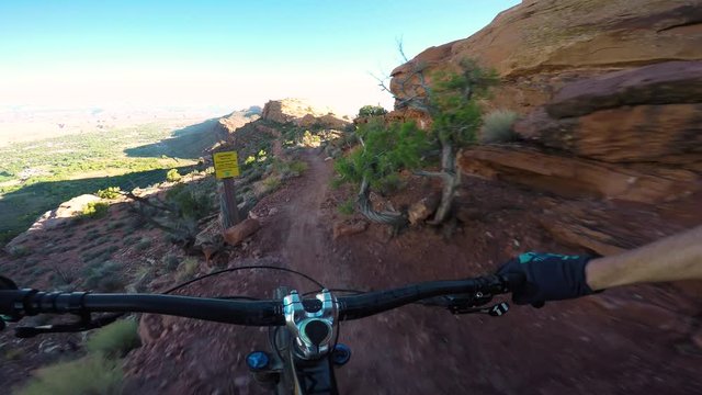 Mountain Biker Riding Dangerous Trail