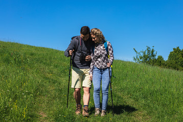 Young couple enjoying hiking together in nature.