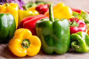 Colorful green , red and yellow peppers paprika background.
