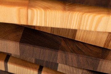 Obraz na płótnie Canvas Fragments of wooden cutting boards close-up