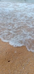 white waves on the golden sand in the beach sea background image