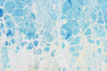Beautiful background of liquid acrylic in blue and white on canvas