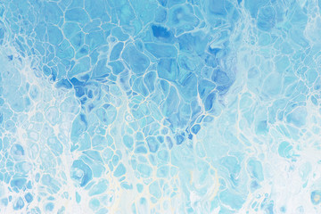 Beautiful background of liquid acrylic in blue and white on canvas