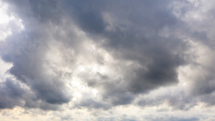 Obraz premium Aerial image of dark Storm clouds over the land. Aerial panorama of storm clouds. Panorama of thunder clouds. View from drone. Aerial bird's eye view. Aerial top view cloudscape. Texture of clouds.