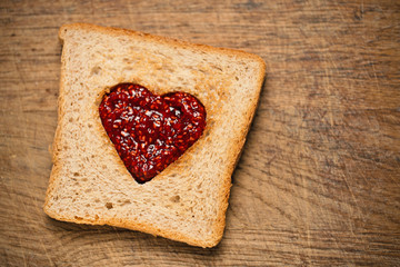 toast bread with heart shape and jam