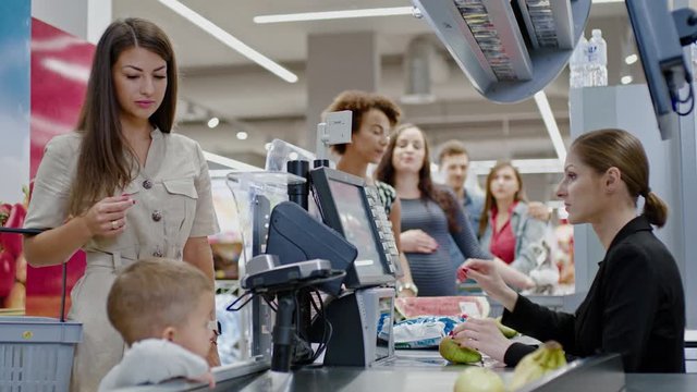 Woman buying goods in a grocery store