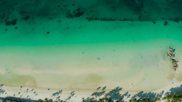 White sand beach and lagoon with turquoise water, aerial view. Coast of the island of Boracay, Philippines. Boracay island Grotto, Willy's Rock.