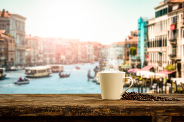 Fresh hot italy coffee and blurred background of city 