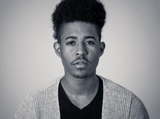 Obraz premium Fashion portrait of Attractive african american male model posing happy and sexy for the camera