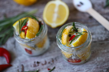 Salted canned lemons in a jar. Fermenting lemons. Probiotics Selective focus. Macro.