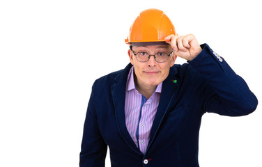 a man in a dark blue jacket and construction helmet peers into the frame