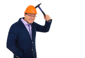 a man in a construction orange helmet tests the strength of the helmet with a hammer