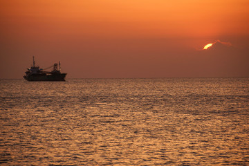 Ship silhouette and sunset