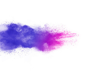 Freeze motion of purple color powder exploding on white background.