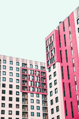 Fototapeta na wymiar Pink apartment building. Modern architecture art. Minimal and urban concept