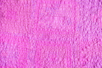 surface of scarf stitched from crushed pink fabric