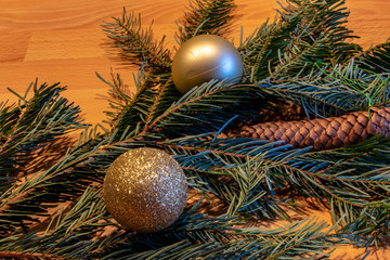 German Christmas, various Christmas tree decorations together with wood branches, pine cones and Christmas cookies