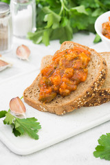 Vegetable caviar in a white bowl on a light gray table