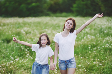 Fototapeta premium mother and daughter having fun in the park