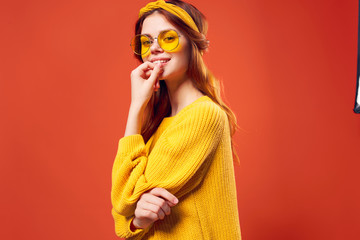 Jolly woman in a yellow sweater