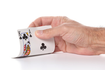 caucasian man's hand showing ace and king diamond poker cards isolated on white background with copy space for your text