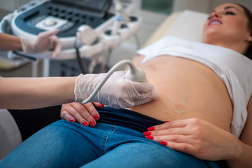 Pregnant woman on utltrasonographic examination at hospital
