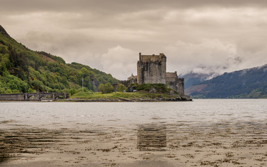 Eilean Donan Castle Scotland landmark Scottish old fortress medieval lake bay bridge beautiful view long exposure