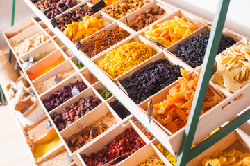 Colorful dried fruits assortment on a rack at the store