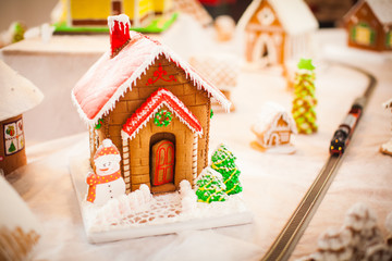 Gingerbread house in the Christmas village on the fair