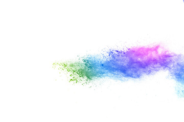 Freeze motion of colorful color powder exploding on white background.  Paint Holi.