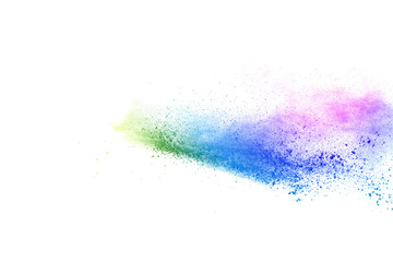 Freeze motion of colorful color powder exploding on white background.  Paint Holi.