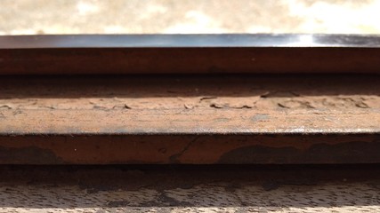 rusty rails on a old wood background
