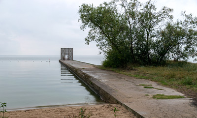 wooden jetty by the sea, Curonian Lagoon in Nida resort town, Neringa, Lithuania