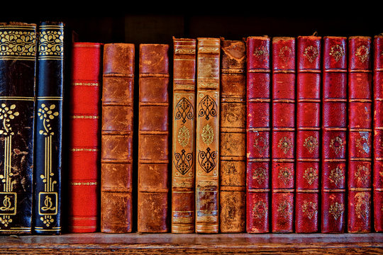 a shelf with old books