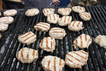 Burgers on a barbeque. Meatballs on a grill. BBQ pattern. Copy space