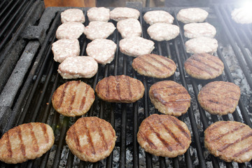 Burgers on a barbeque. Meatballs on a grill. BBQ pattern. Copy space