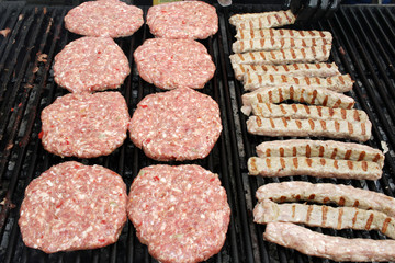 Burgers and sausages on a barbeque. Meatballs on a grill. BBQ pattern. Copy space