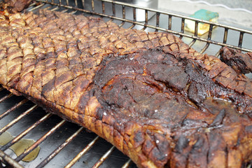 Roasted pork meat. Swine, pig, hog, sow on a barbeque. Grilled meat texture. Meat pattern. Skewer. African swine fever