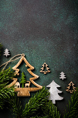 Overhead shoot of wooden christmas tree and decoration. Winter holidays background with copy space, flat lay, top view.