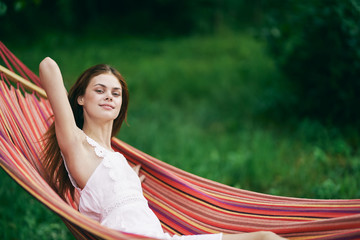 young woman relaxing in hammock