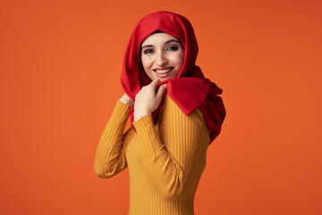 Muslim woman in hijab is cheerful