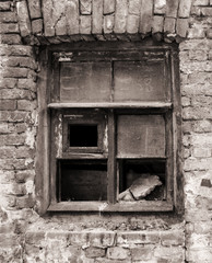 Window frame of ruined house. Destroyed building.