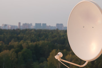 satellite dish on the background of the city