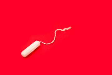 hygienic tampons on a red background, womens health