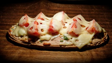 ready to eat - a delicious pizza bread with cherry tomatoes and cheese