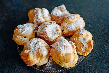 ready to eat on coffe time - cream puffs with powder sugar
