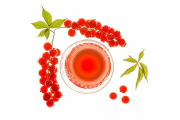 A Backlit Glass of Red Currant Juice with Fresh Berries isolated and  flat layed on a white background.