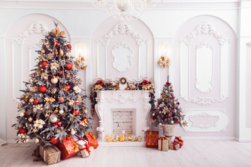 Fireplace in baroque style between Christmas trees